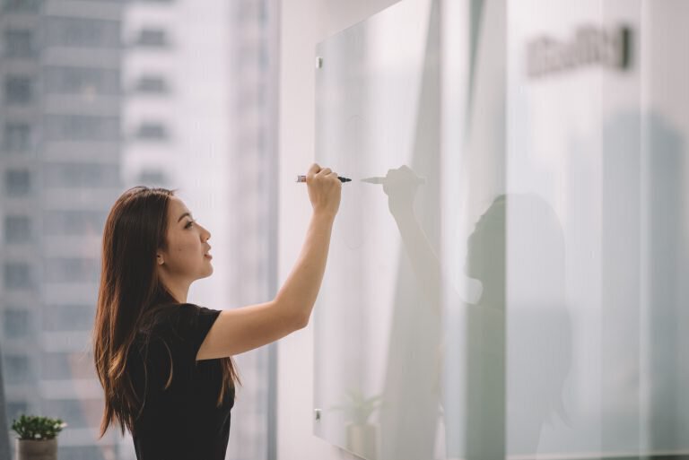 woman using a whiteboard